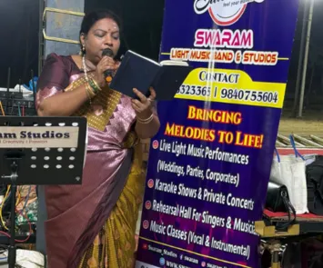 Female singer performing with mic and song book at live event