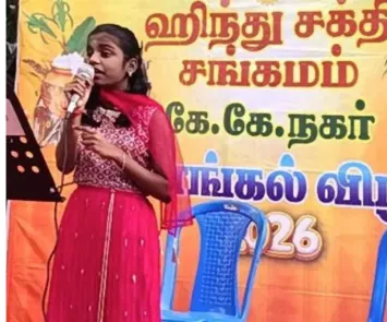 Girl singing on stage at festival event with mic and banner