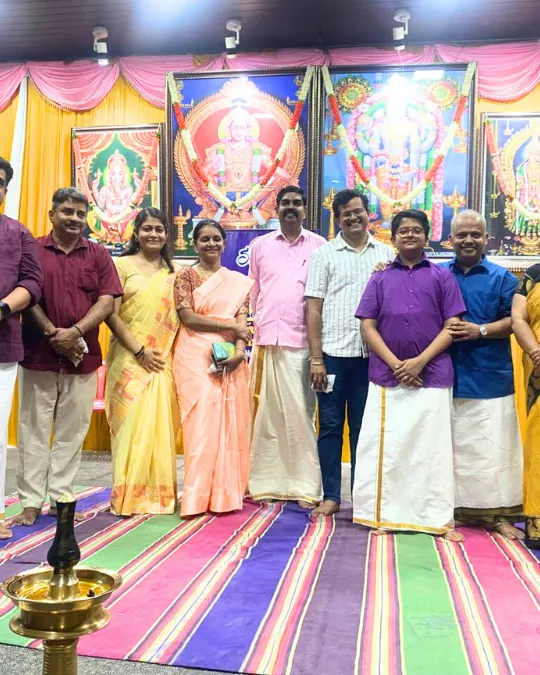 Group photo at temple event with families and music team
