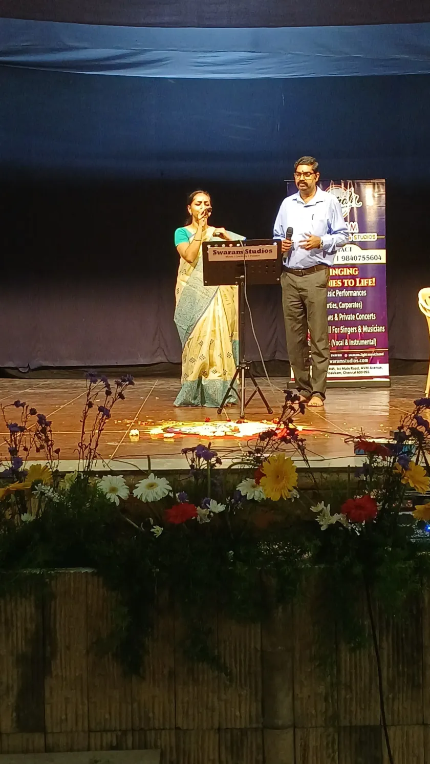 Stage performance with floral decoration at music event