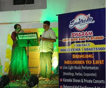 Male and female singers performing duet at music event