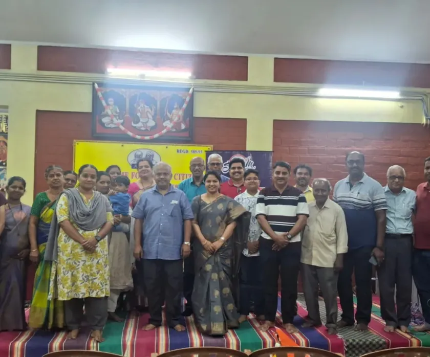 Participants posing together at social gathering hall