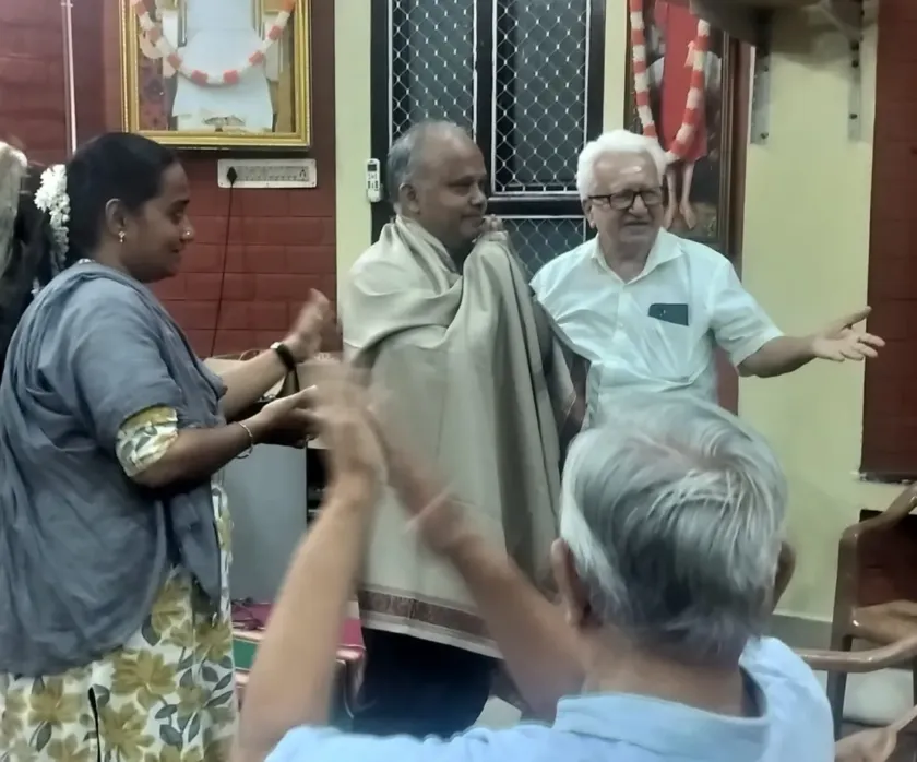 People greeting and interacting at community function