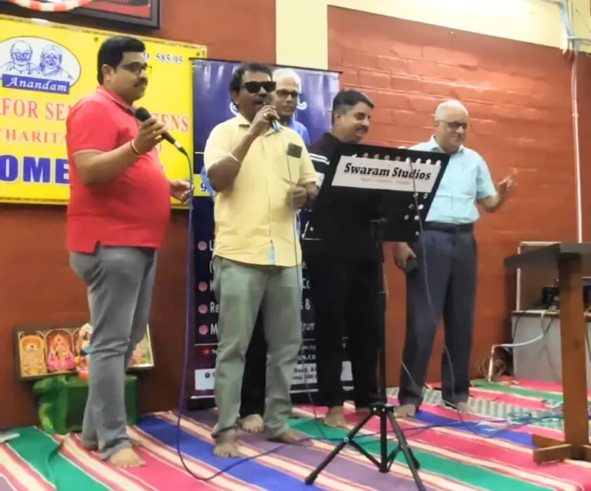 Live singing performance at Swaram Studios event