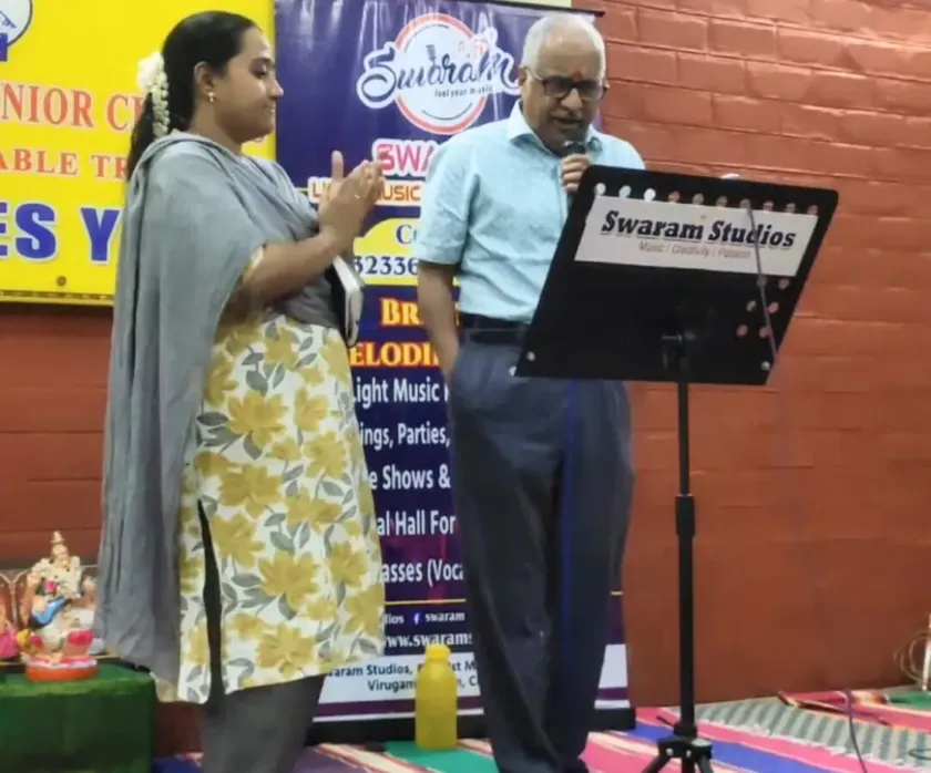 Woman singing on stage at music program