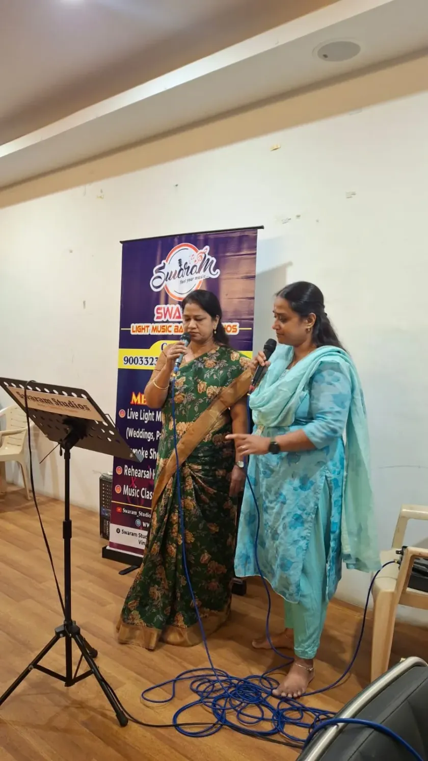 Women singing at Swaram Studios music program