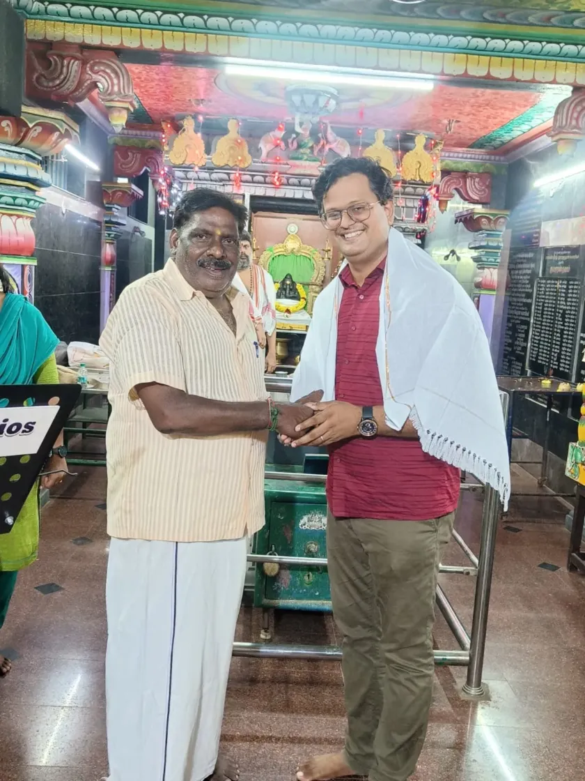 Felicitation ceremony handshake at cultural function