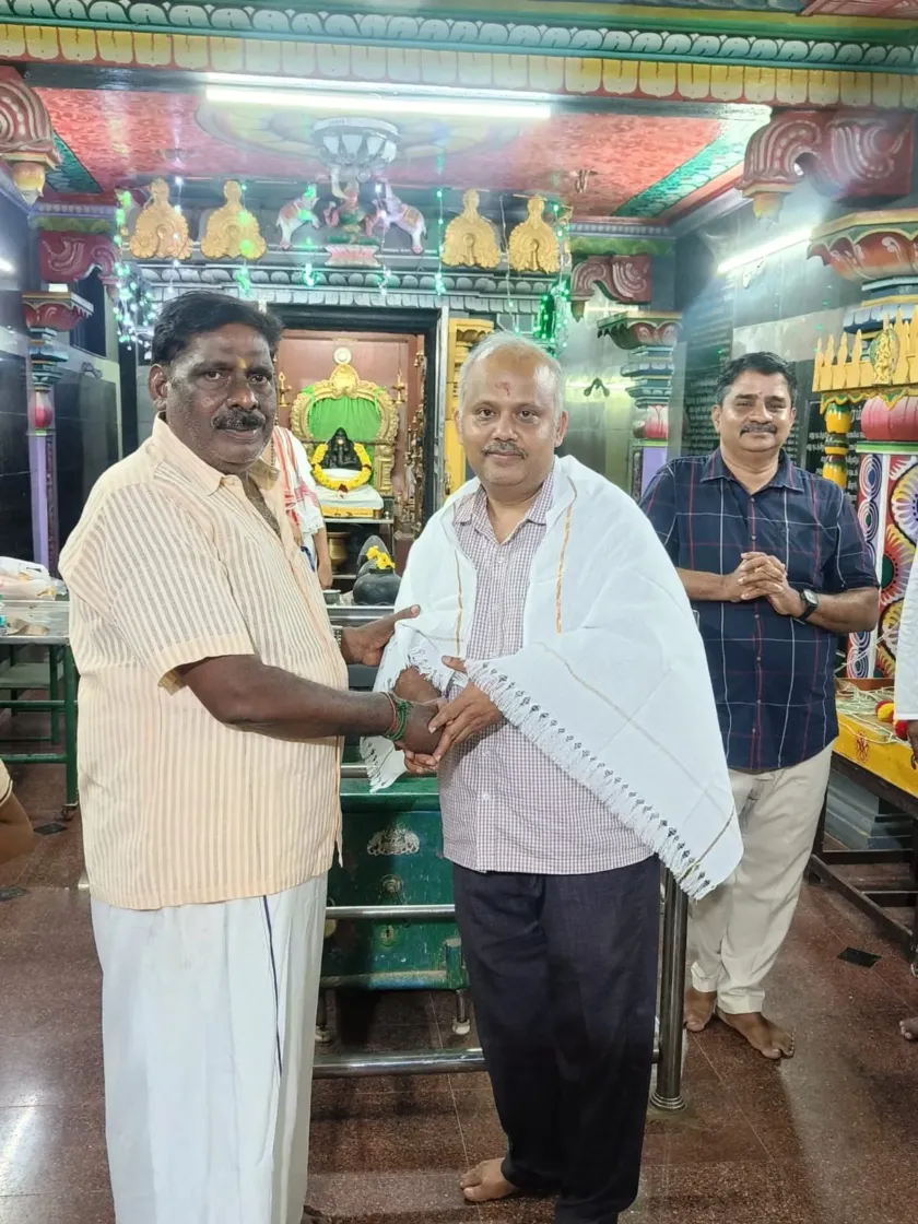 Felicitation ceremony with shawl at temple event