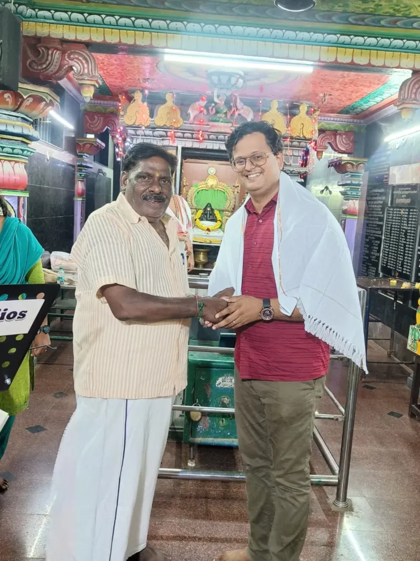 Felicitation handshake at cultural temple event