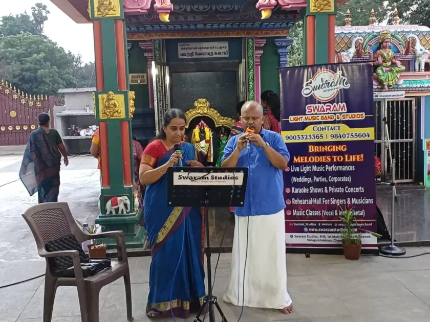Duet singing at temple entrance music program