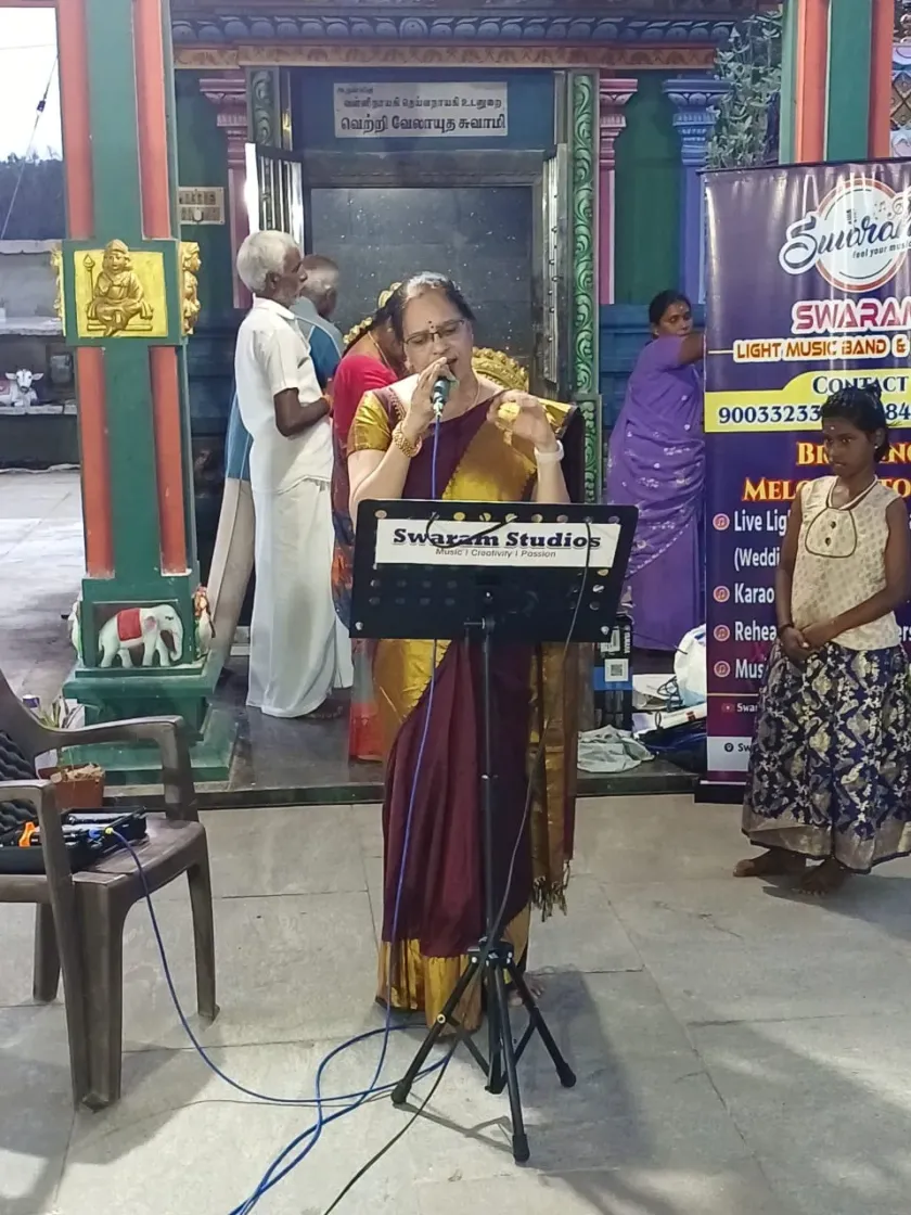Female singer performing at Swaram Studios event