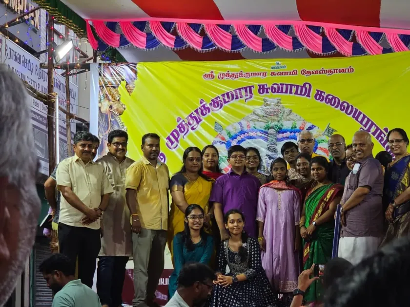 Group photo at temple festival event with families and team