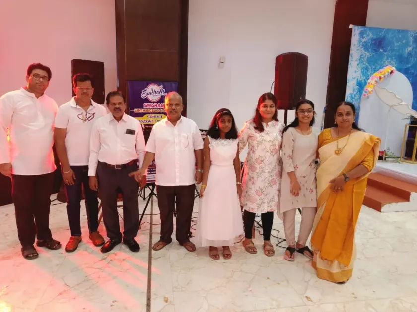 Team posing at live music program stage