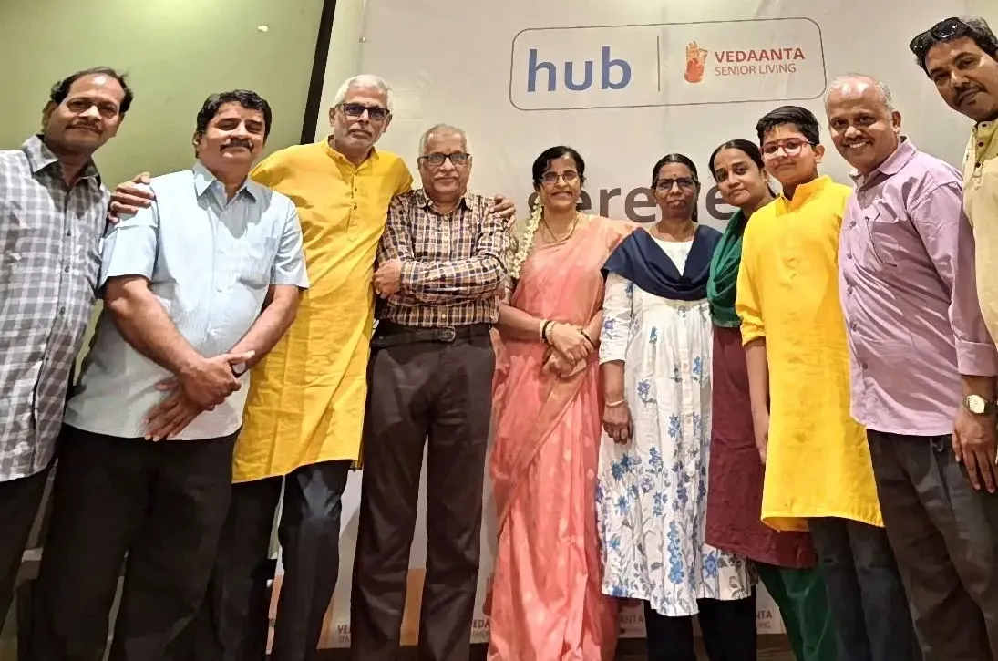 Group photo at indoor event with families