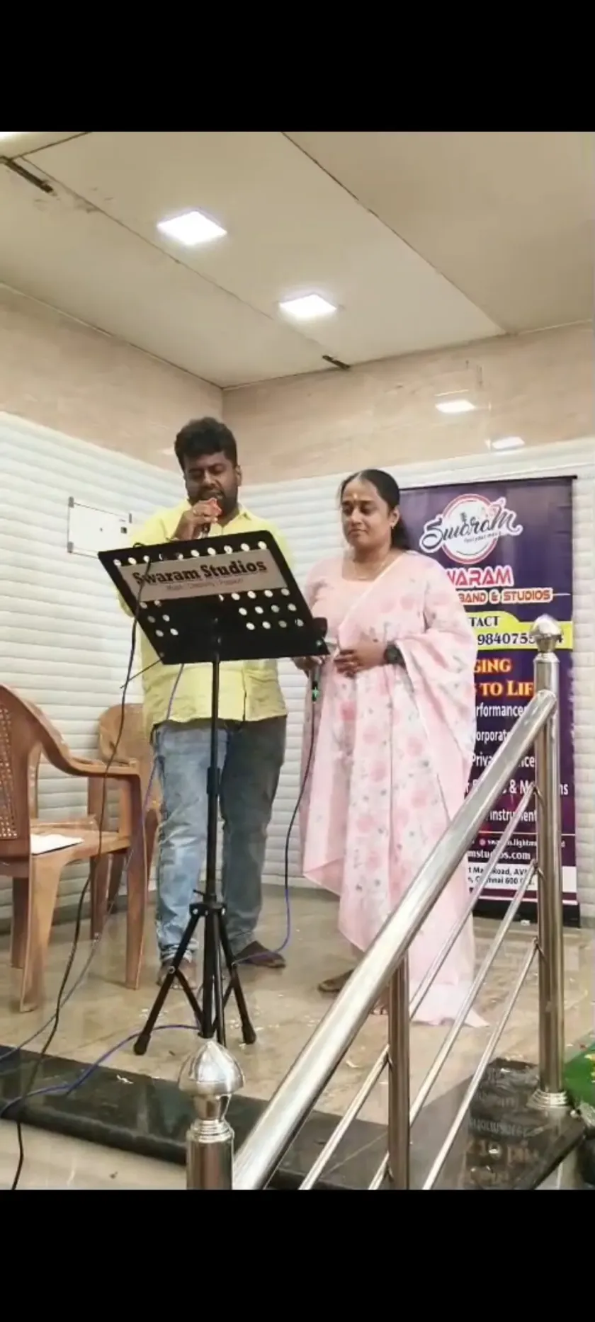 Duet singing performance at live music program