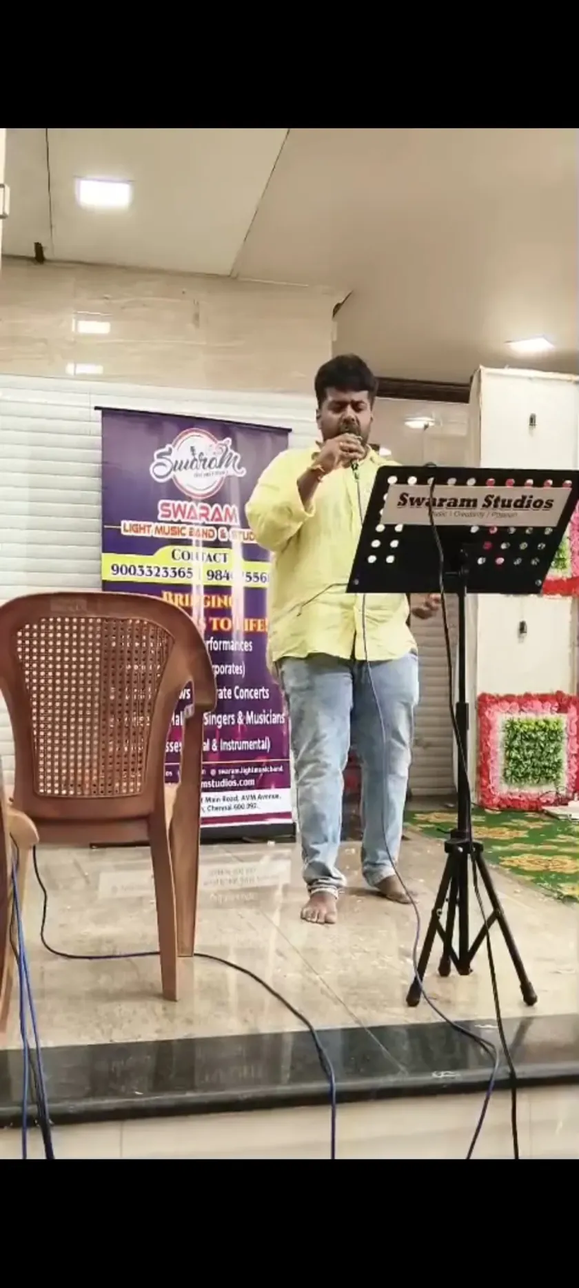 Male singer performing at live music program