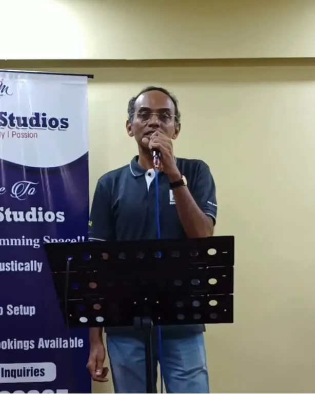 Male singer performing with microphone at music studio event