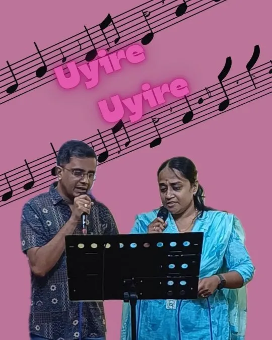 Male and female singers performing duet with musical notes background