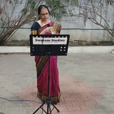 woman-singing-at-outdoor-event-image-swaram-studio